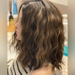 Synthetic Wig Never worn, cap is average size and adjustable, hair is very silky